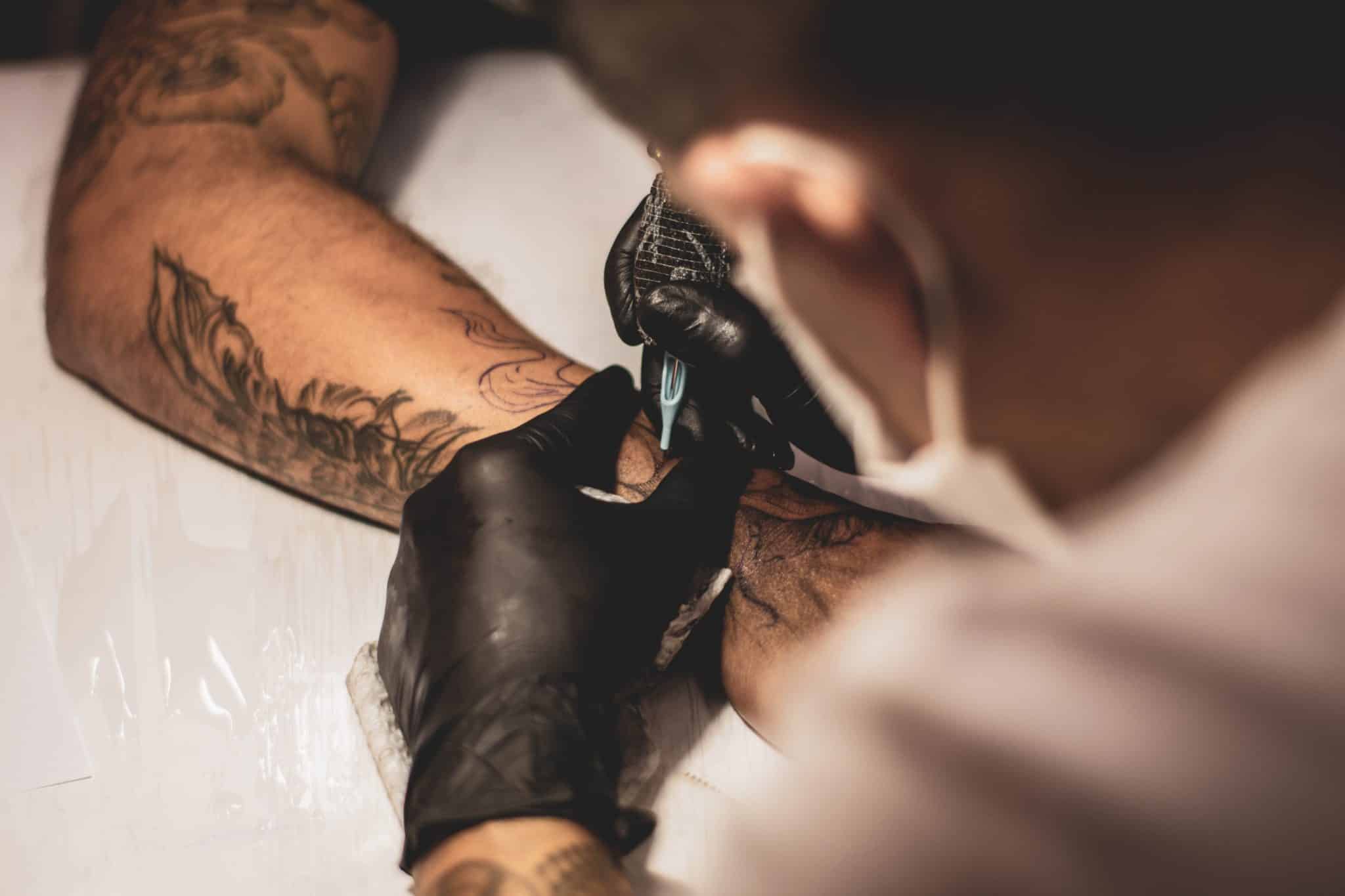 Tattoo Artist Making Koi Fish Tattoo