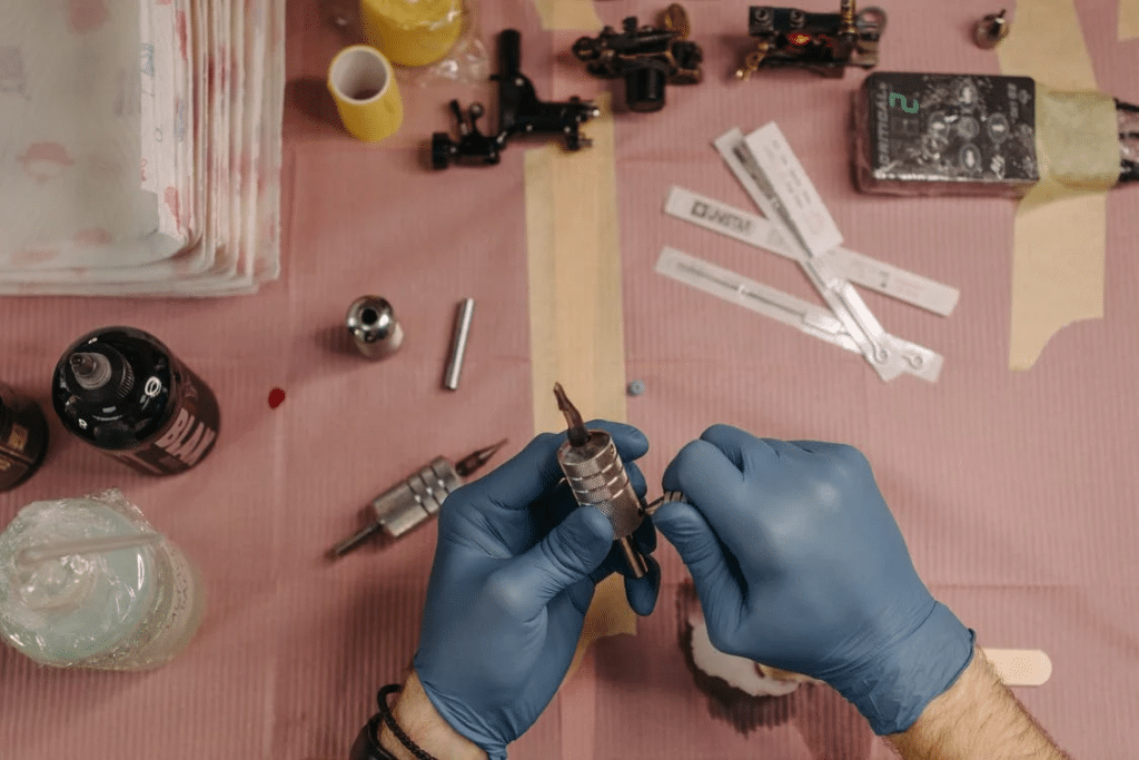 Artist Fixing Tattoo Pen Grip