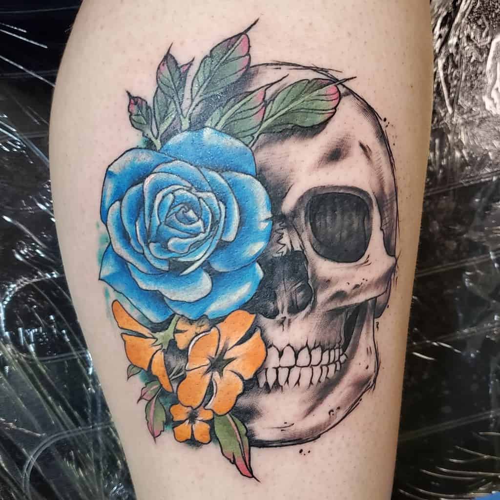 skull and rose leg tattoo