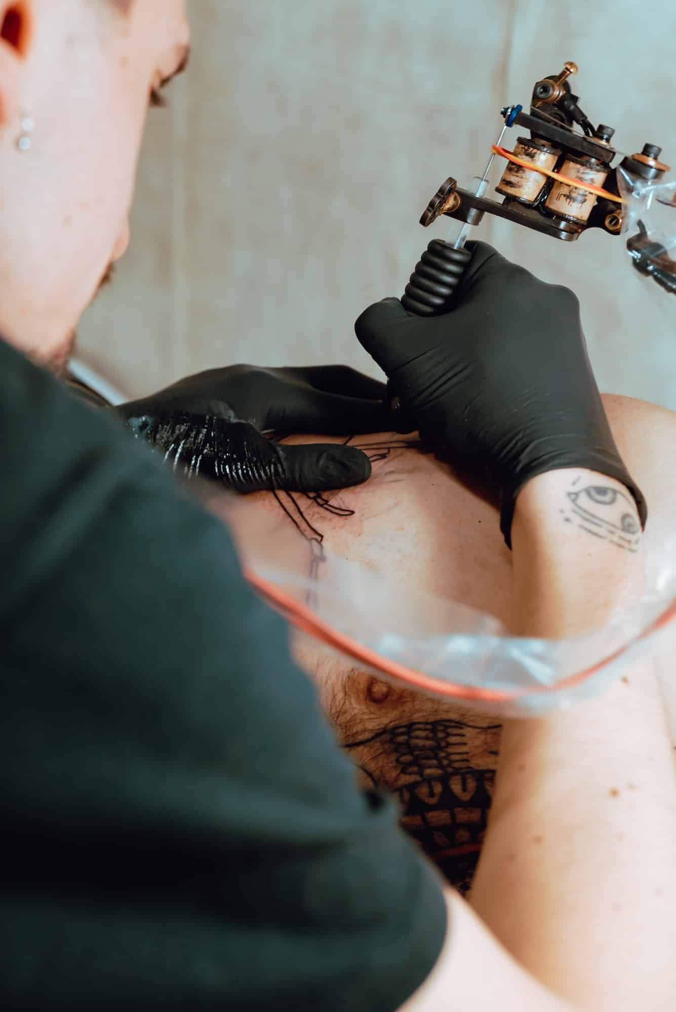 Stylish woman making tattoo