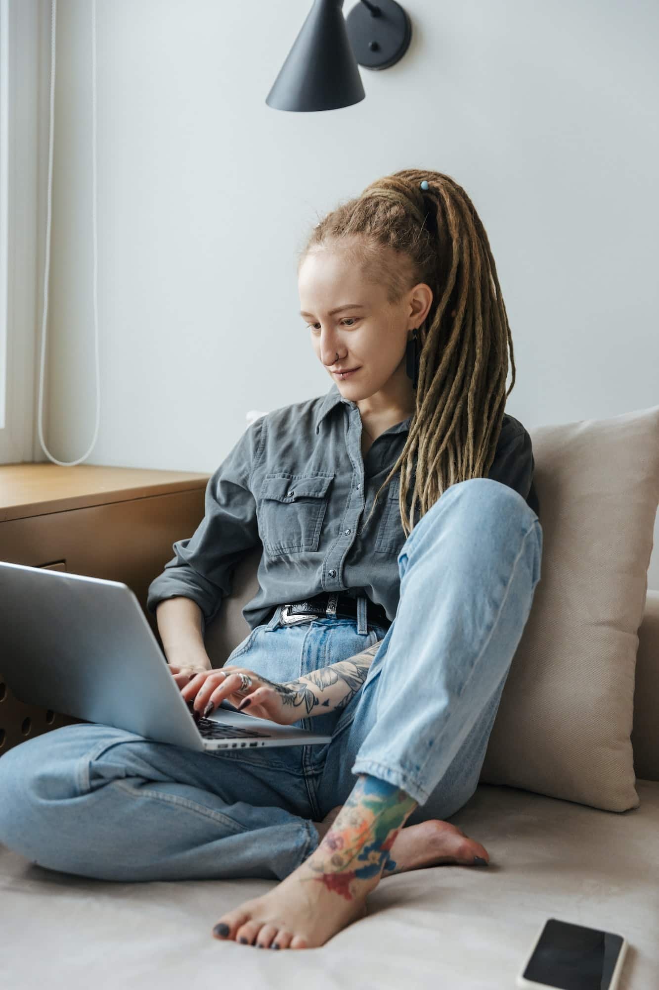 Concentrated young girl using laptop computer.