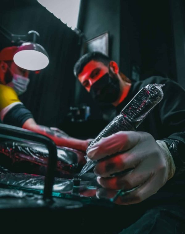 Tattoo Artist Preparing Tattoo Machine