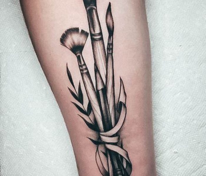 artistic-paint-brush-tattoo-on-woman