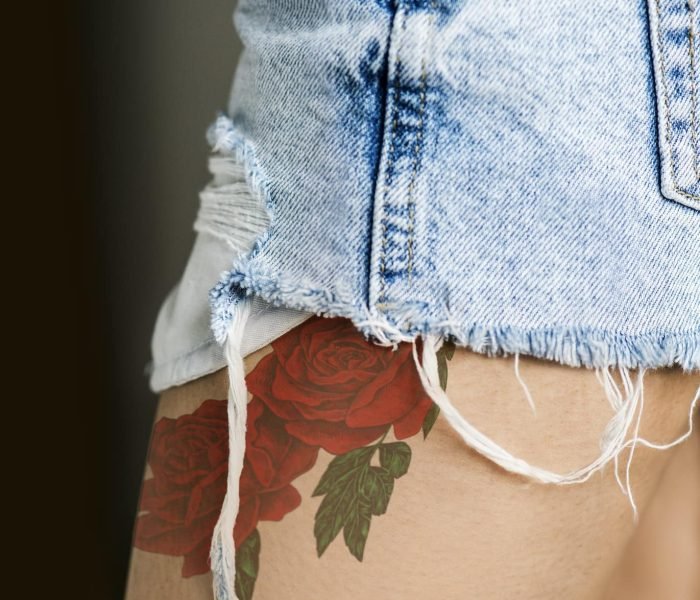 Closeup of a upper thigh tattoo of a woman