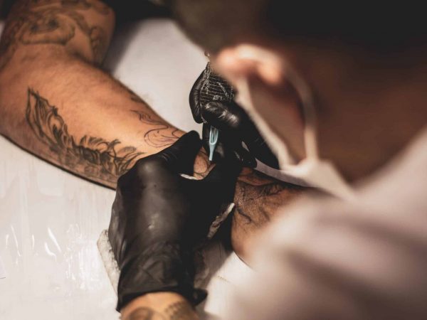 Tattoo Artist Making Koi Fish Tattoo, small tattoo for dad
