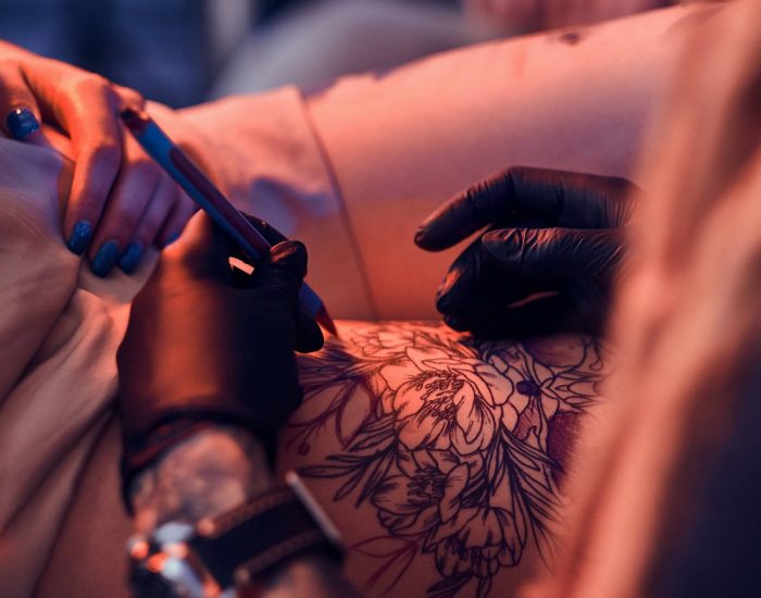Process of makining new tattoo at tattooing salon