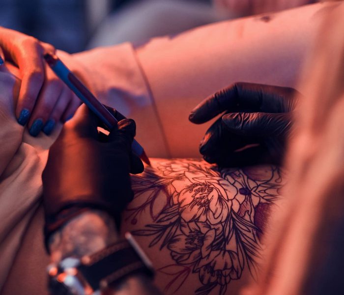 Process of makining new tattoo at tattooing salon