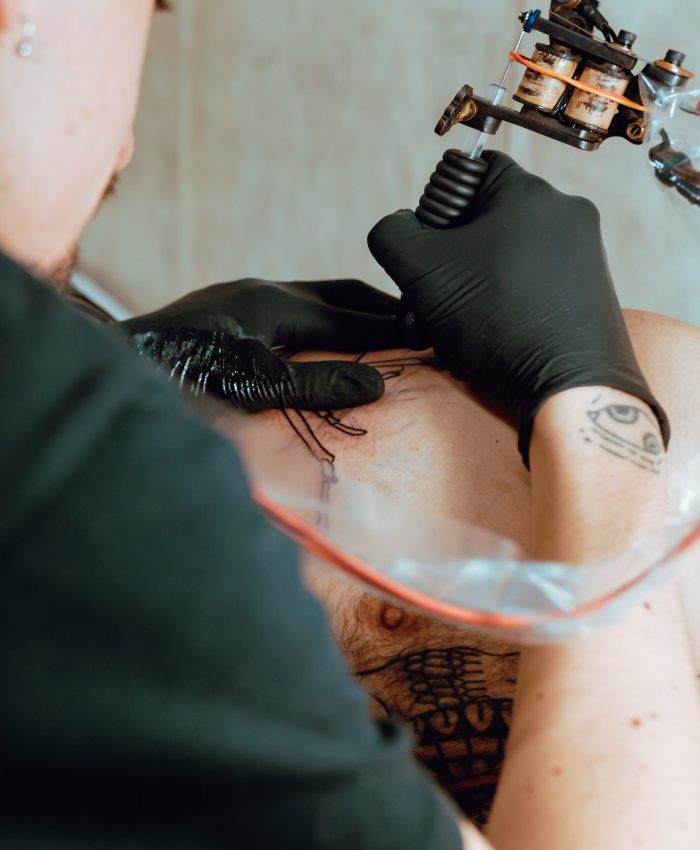 Stylish woman making tattoo