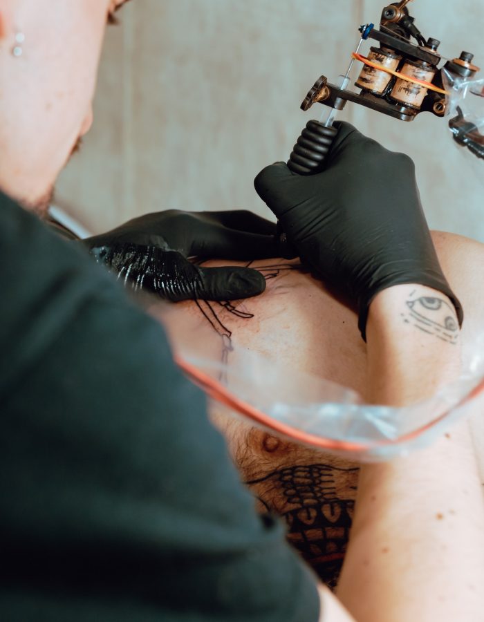 Stylish woman making tattoo
