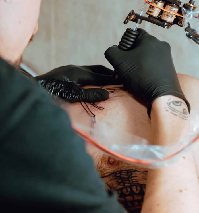 Stylish woman making tattoo