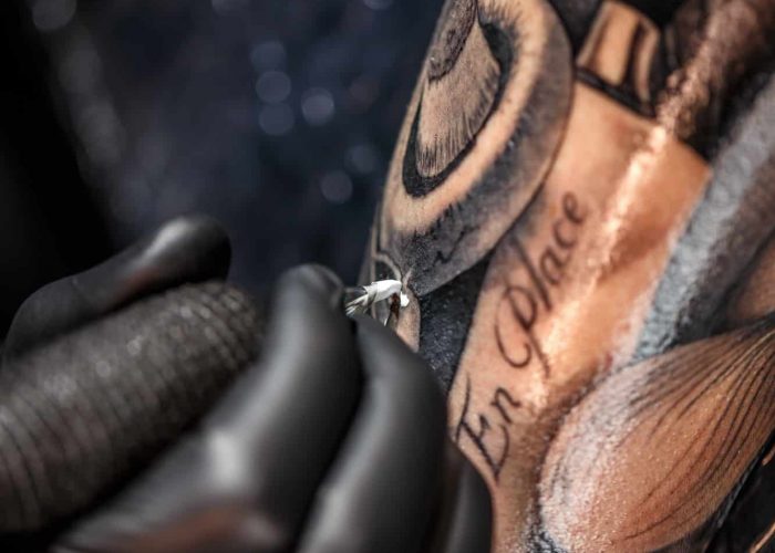 Tattoo artist tattooing
