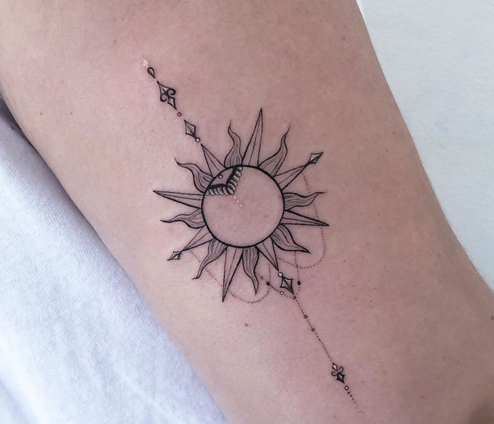 Sun and Moon Tattoo on arm